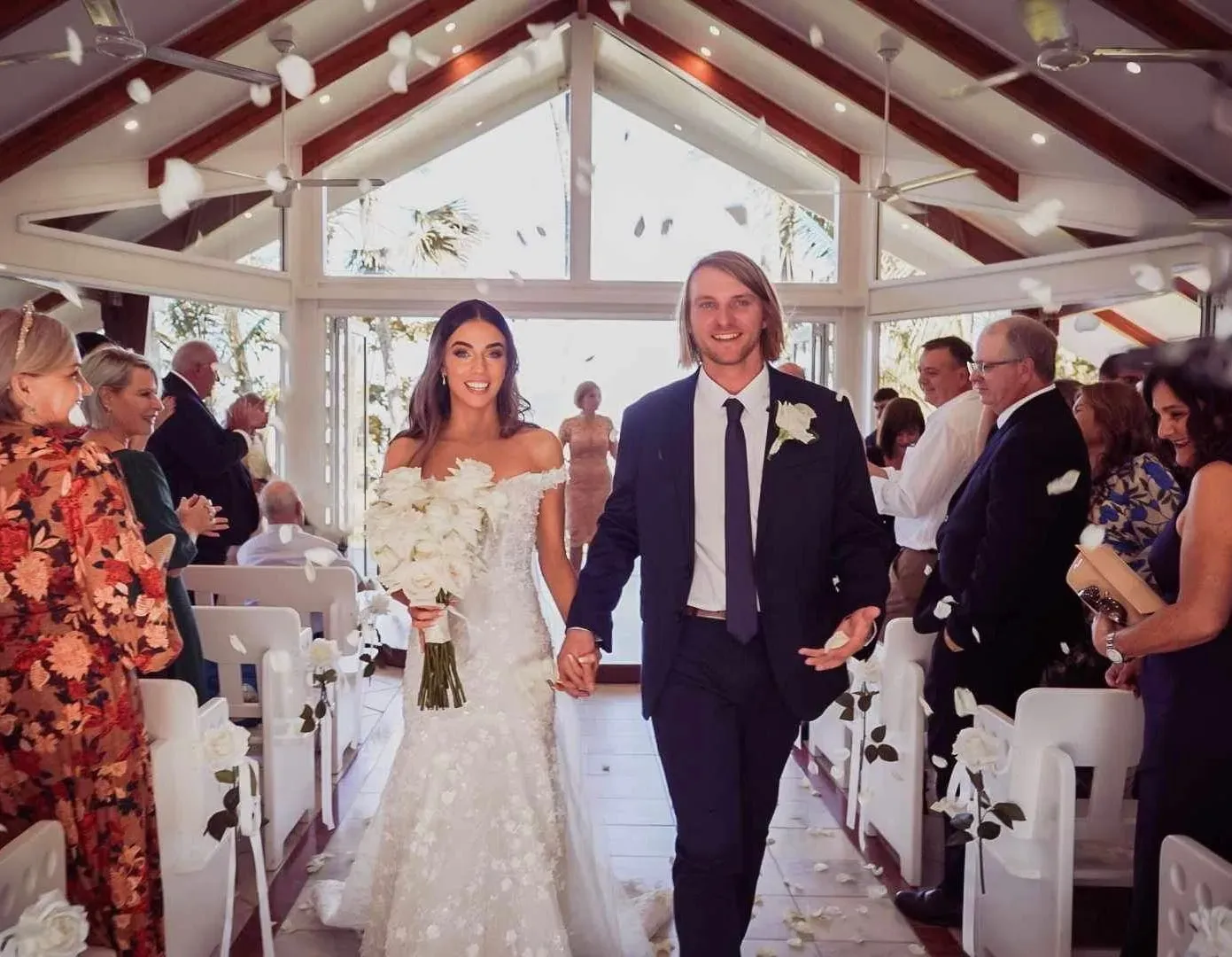 A Bride and Groom Are Walking Down the Aisle of a Church โ GinaS Cairns Tropical Weddings in Parramatta Park, QLD