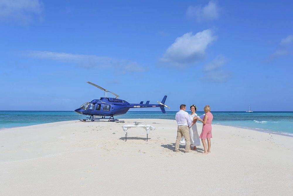 A Couple is Getting Married on a Small Island With a Helicopter — GinaS Cairns Tropical Weddings in Parramatta Park, QLD
