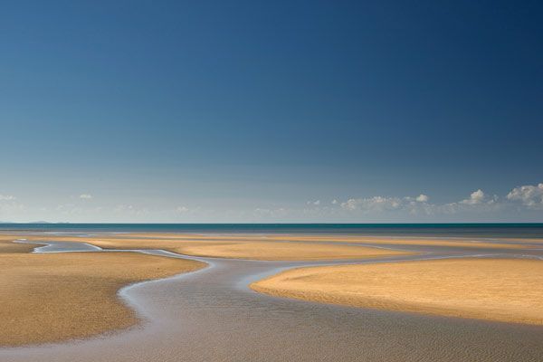 There is a Stream Running Through the Sand on the Beach — GinaS Cairns Tropical Weddings in Port Douglas, QLD