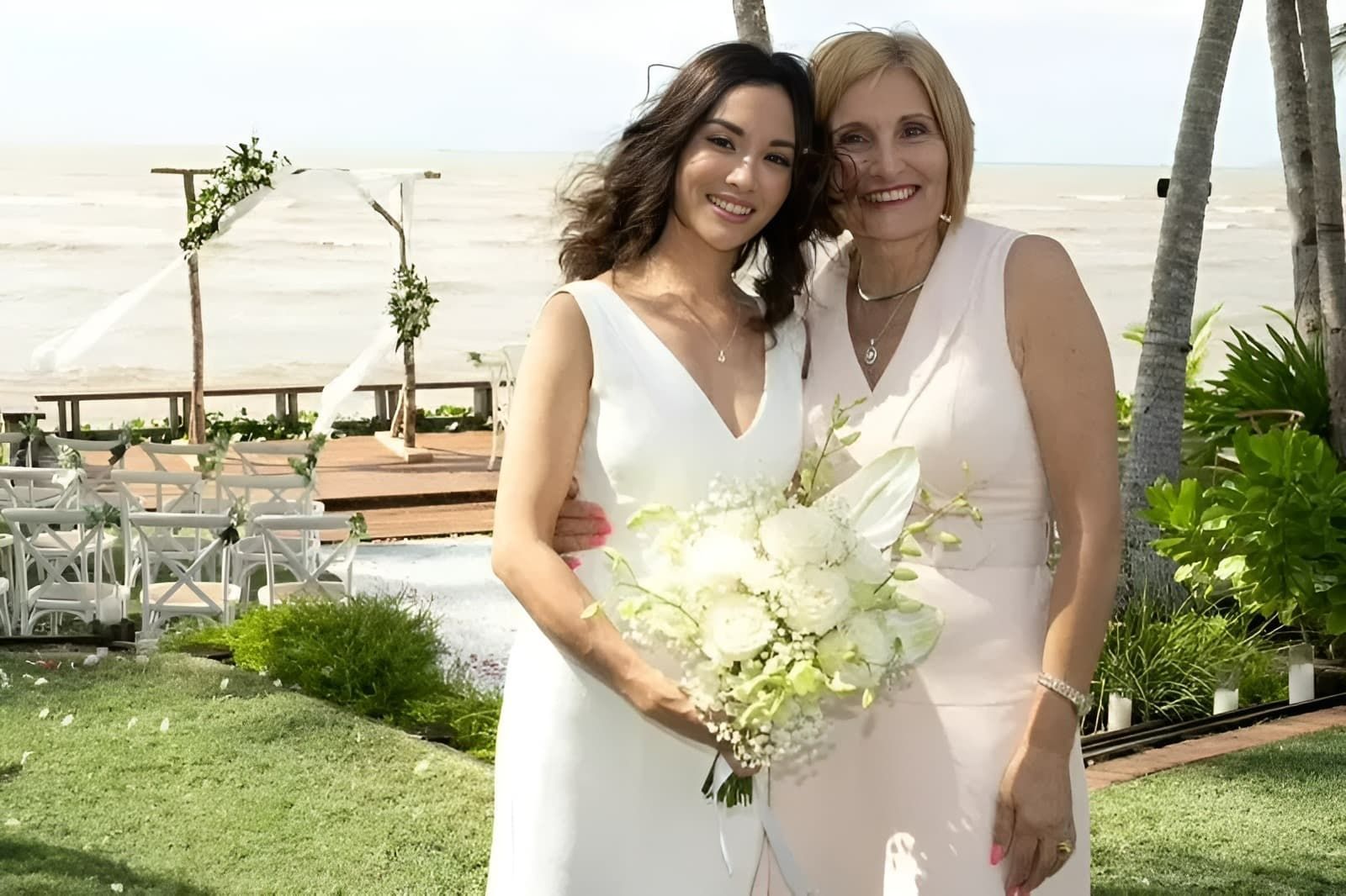 A Bride Are Posing for a Picture in Front of the Ocean โ GinaS Cairns Tropical Weddings in Parramatta Park, QLD