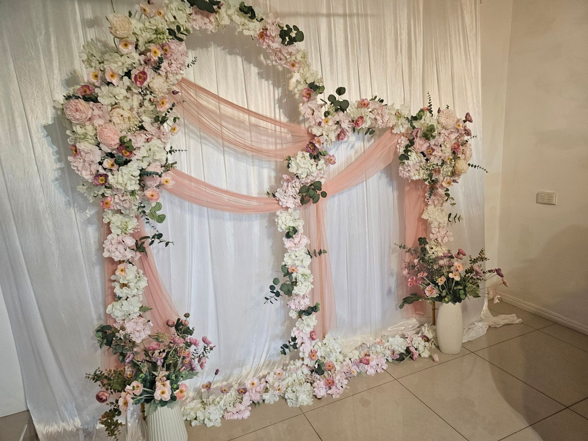 Floral Wedding Backdrop with Pink Drapes — GinaS Cairns Tropical Weddings in Parramatta Park, QLD