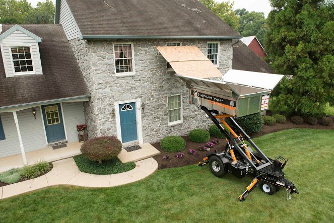 An aerial view of a house with a trailer attached to it.