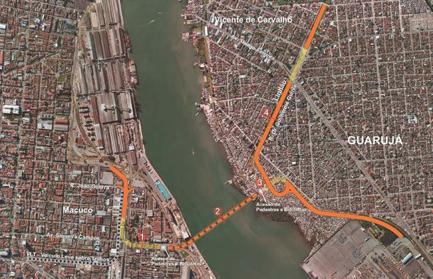 Mapa aéreo da região de Santos-Guarujá mostrando uma proposta de conexão por túnel, marcada com uma linha tracejada laranja.