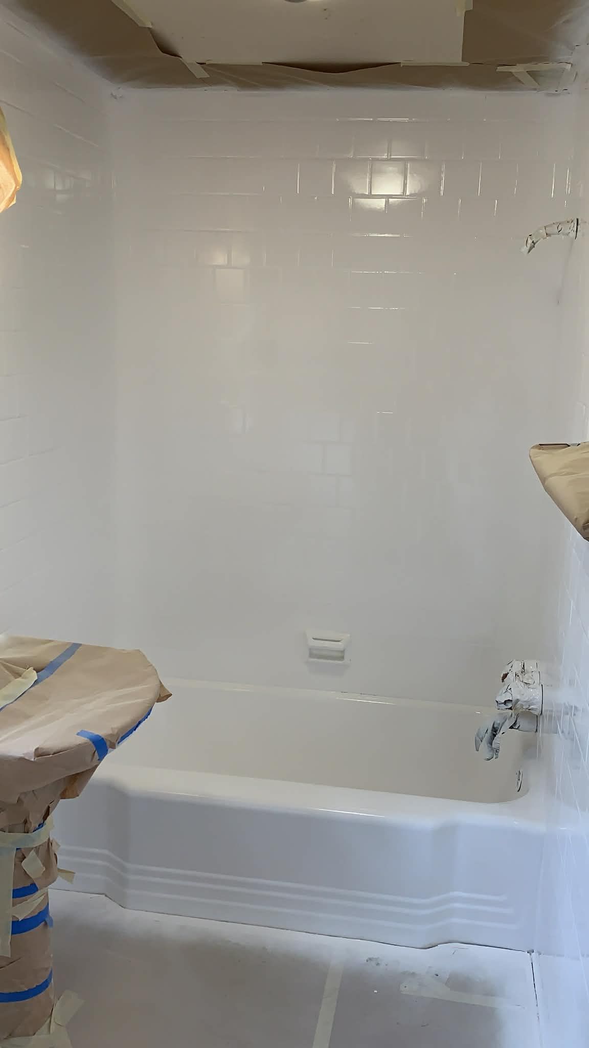 Image of a bathtub that is being reglazed. 