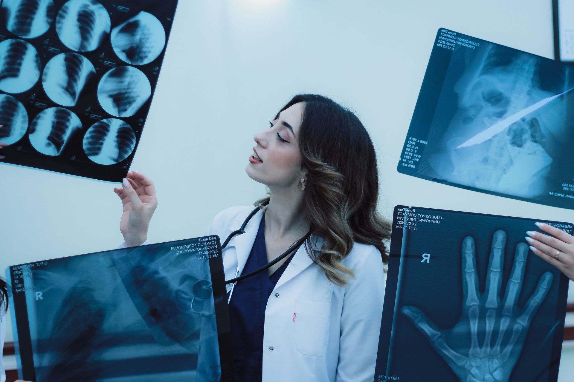 Doctor examining X-ray films in a medical setting