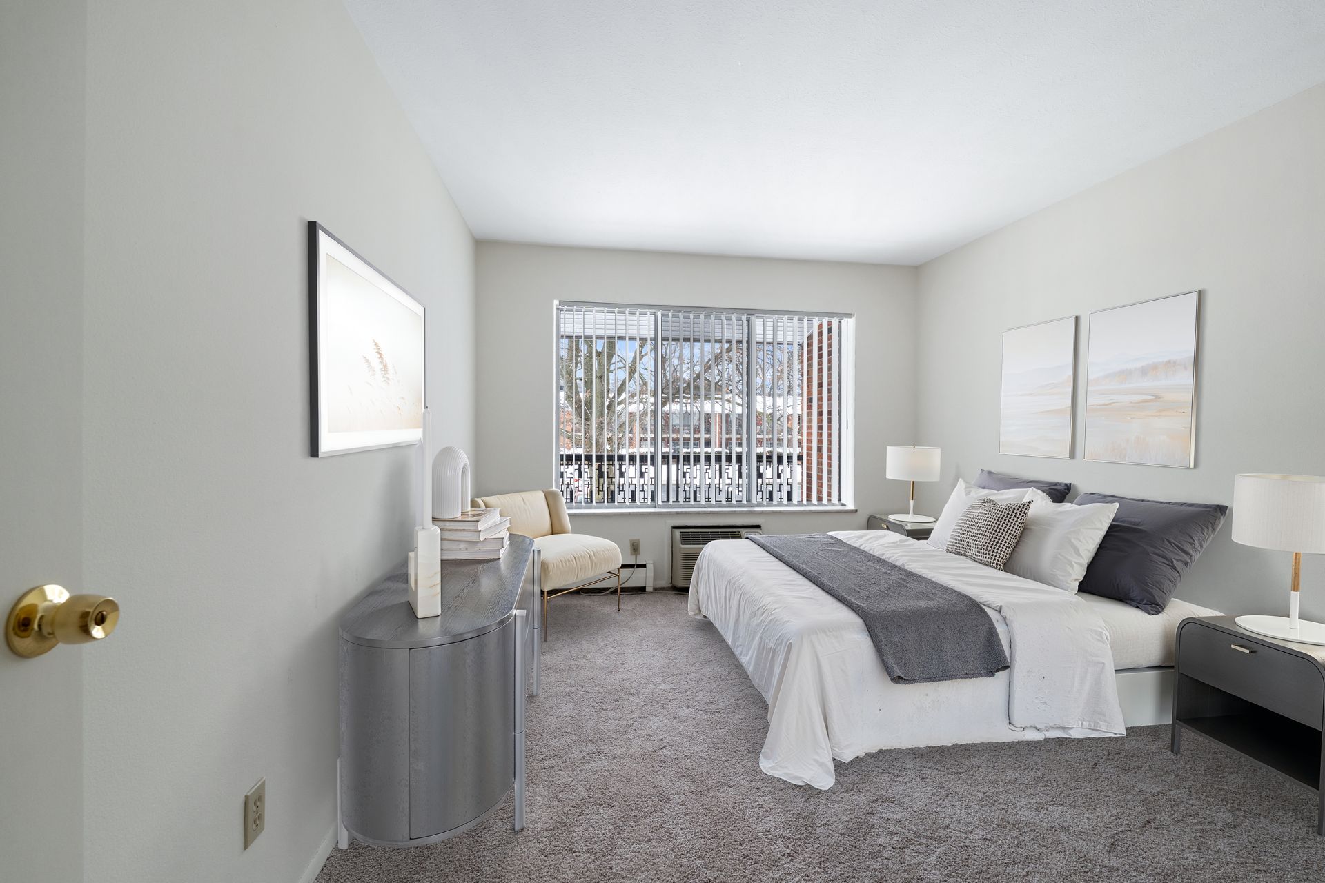 Photo of a bedroom with plenty of walking space and a wide window