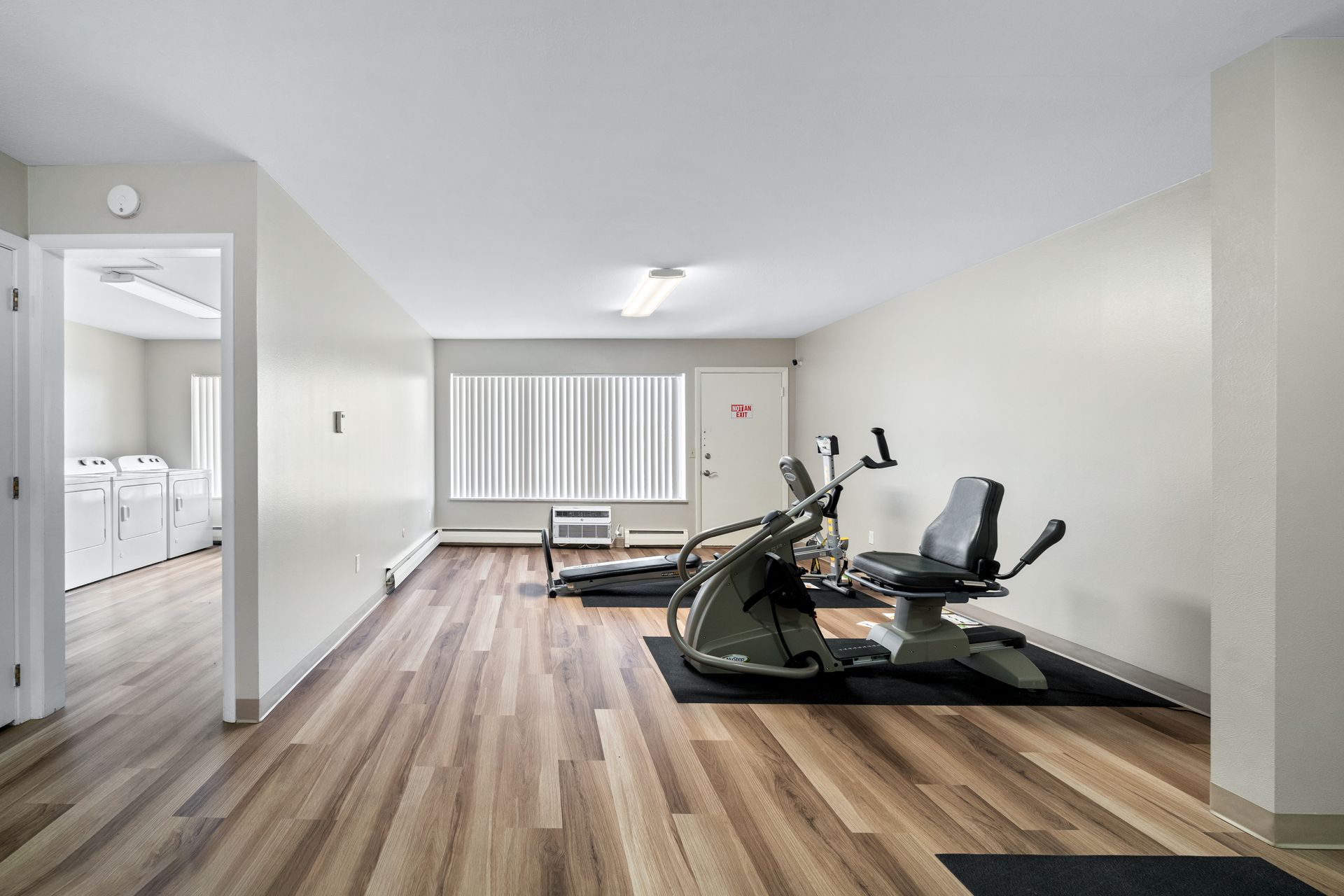 Photo of the gym with the laundry room in the background