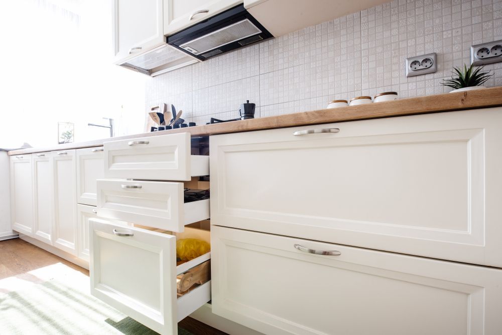 Bright White Kitchen With an Open Lower Cabinet — The Right Kitchen Company In Berkeley, NSW