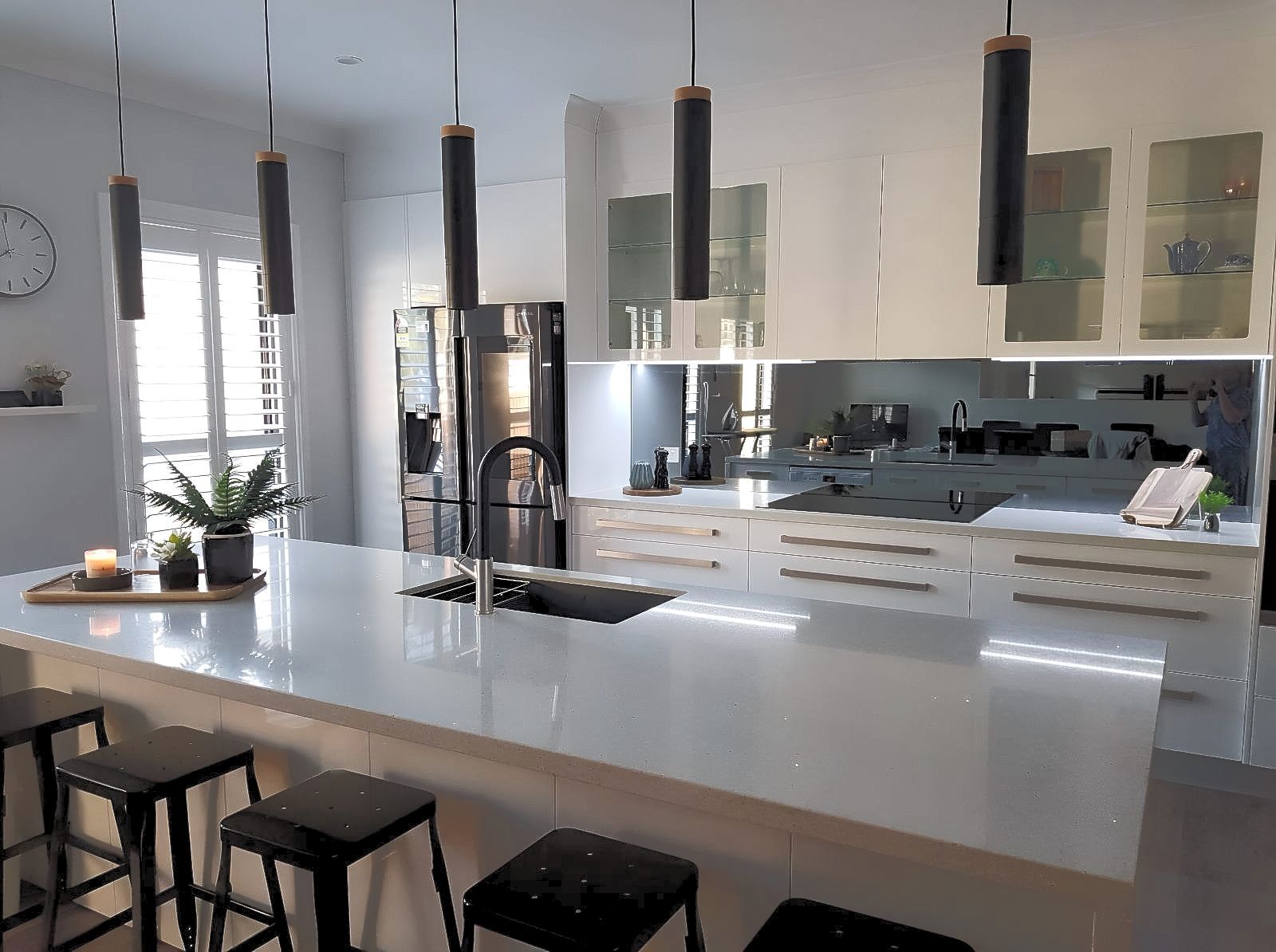 A Kitchen With White Cabinets And A Silver Refrigerator — The Right Kitchen Company in Dapto, NSW
