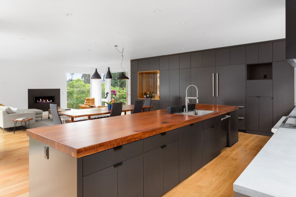 Modern Open-plan Kitchen With Dark Cabinets — The Right Kitchen Company In Berkeley, NSW