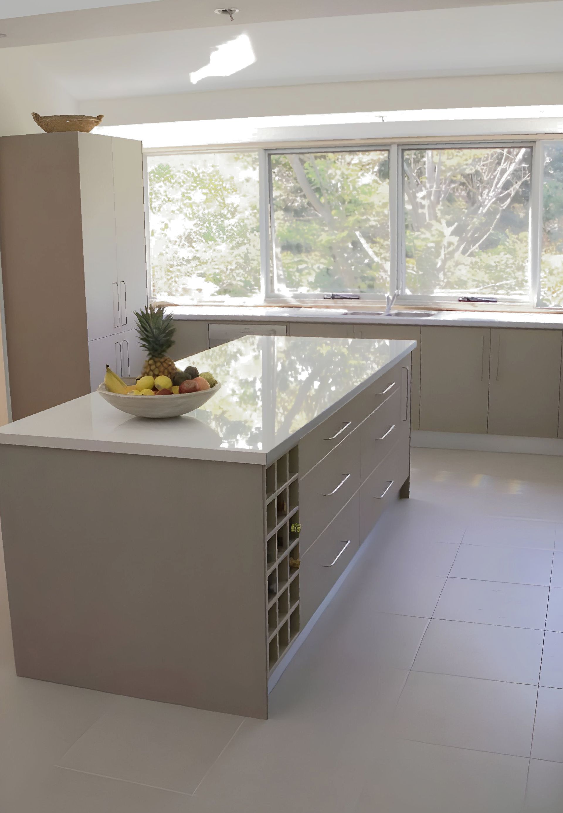 A kitchen with island bench and fruit bowl on top — The Right Kitchen Company in Dapto, NSW