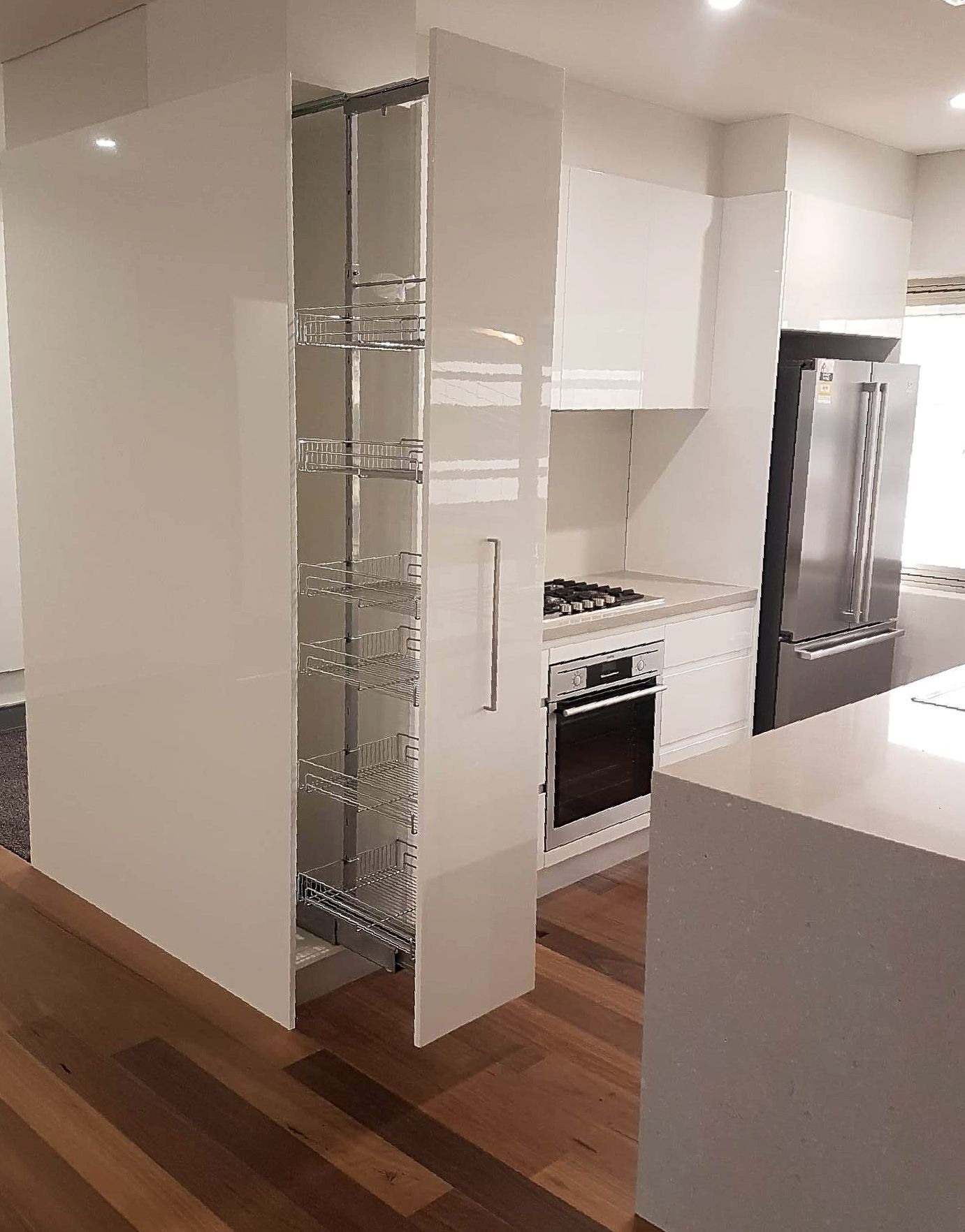 Modern White Kitchen With Open Pantry Drawer — The Right Kitchen Company In Berkley, NSW
