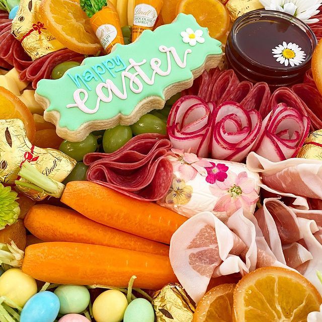 A plate of food with a cookie that says happy easter