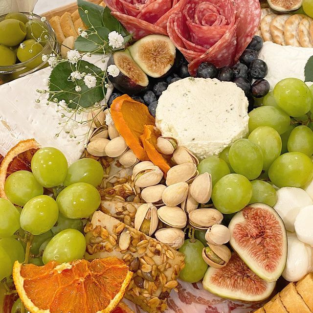 A variety of fruits and vegetables are on a table.
