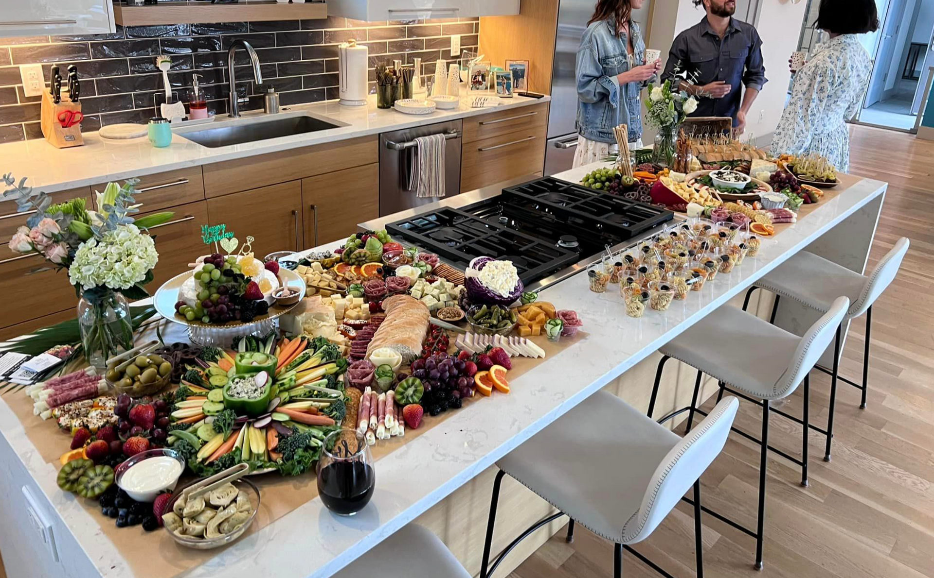 A wooden table topped with a variety of food including fruits and vegetables