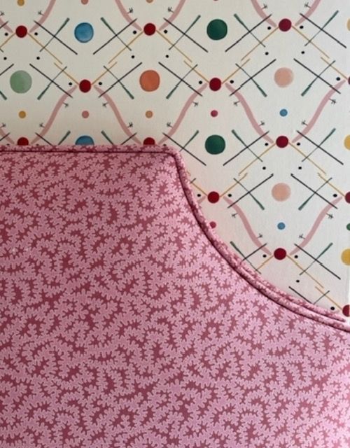 A close up of a pink and white patterned fabric