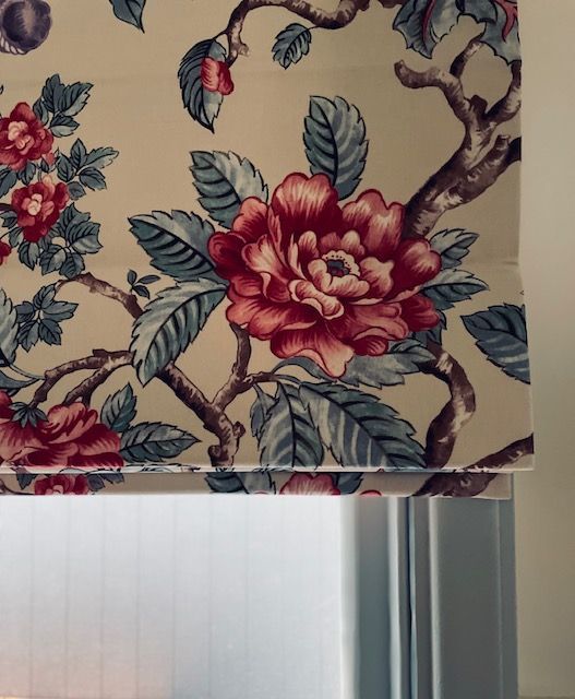 A lamp shade with a floral pattern on it