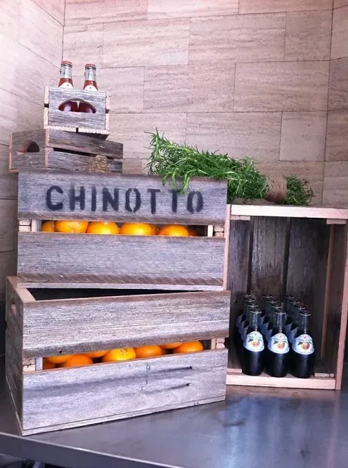 A wooden crate with the word chinotto on it