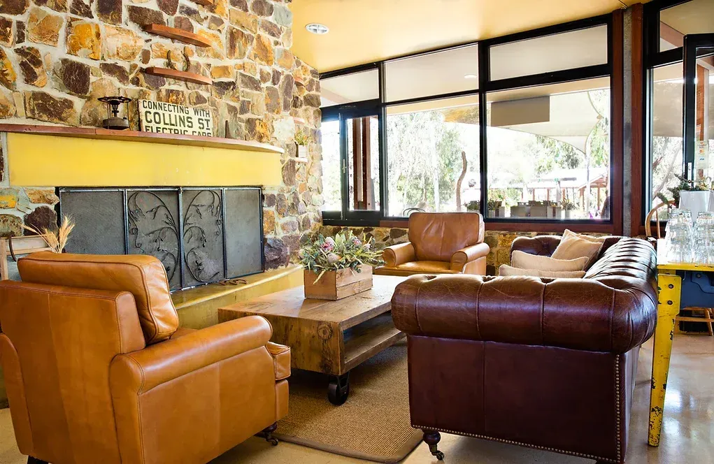 A living room filled with furniture and a fireplace.