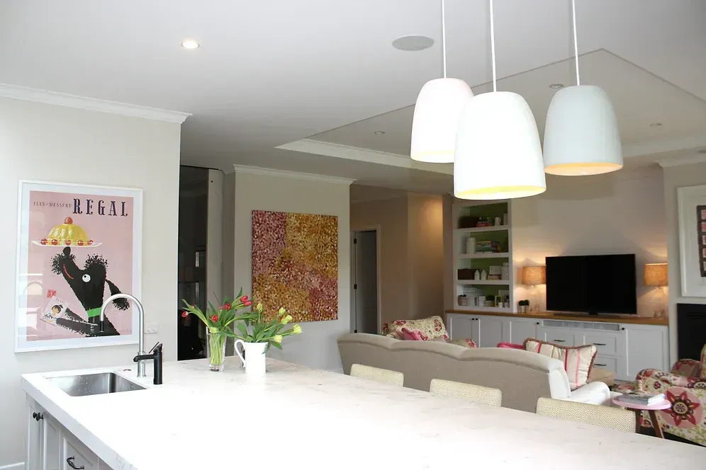 A living room with a painting on the wall that says legal