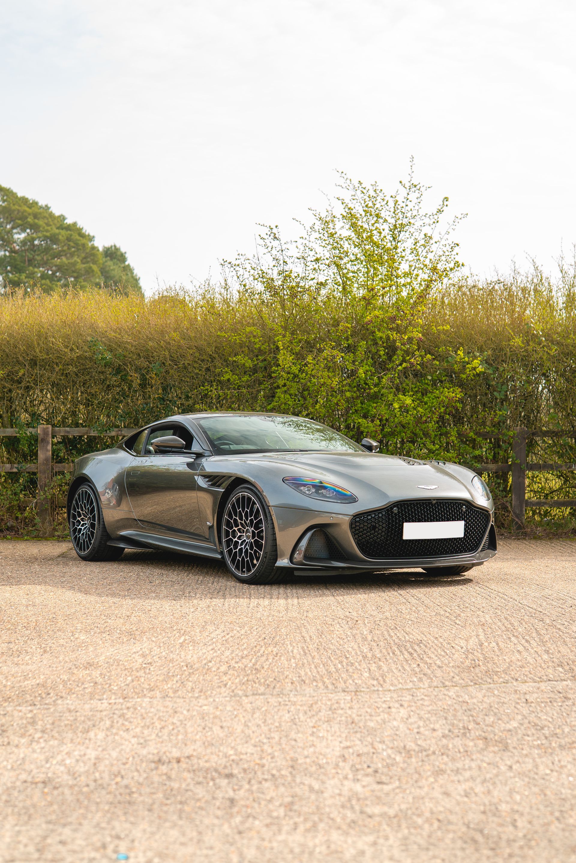 aston martin DBS 770 ultimate grey metallic grey front quarter view angle portrait vertical