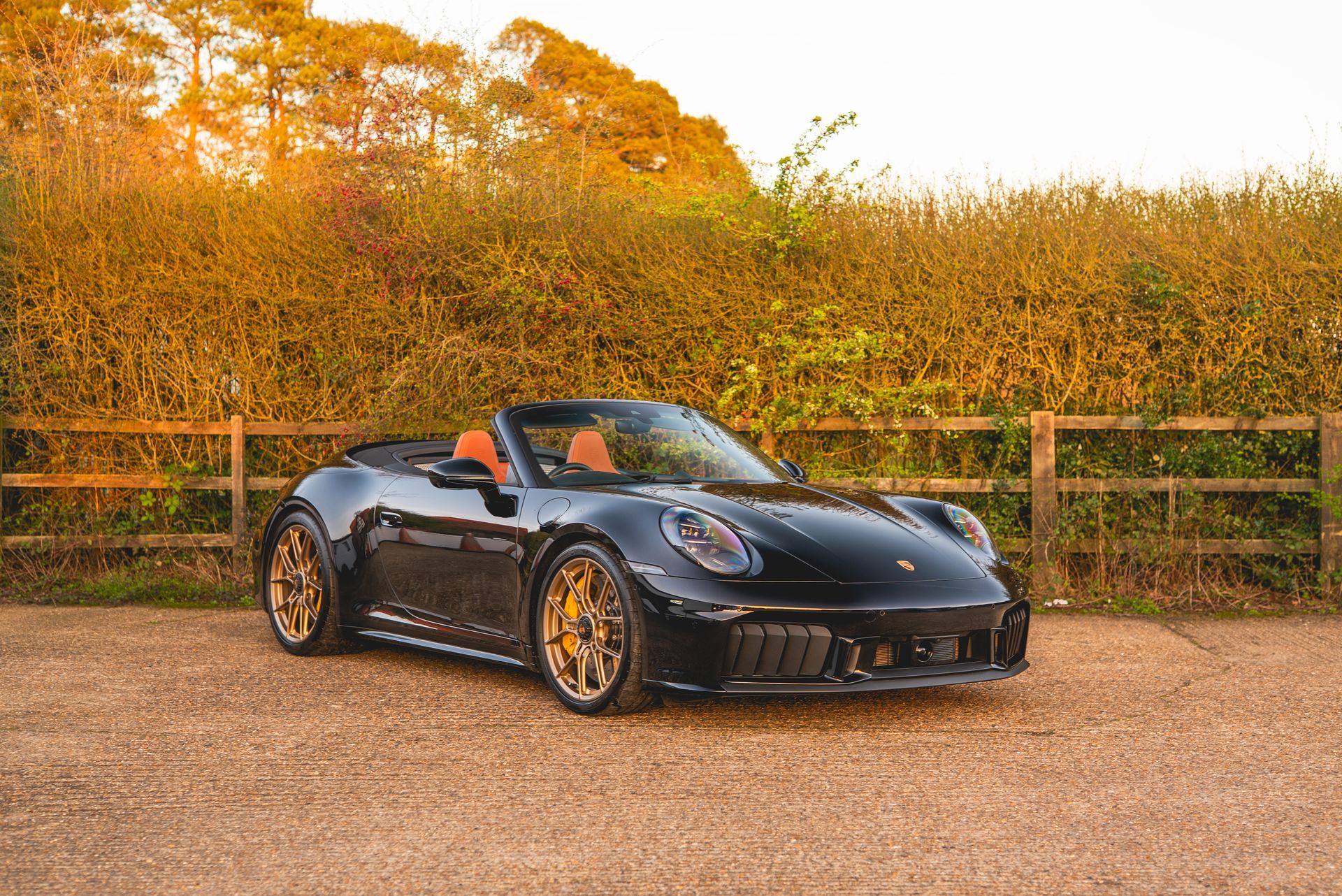 black porsche 911 carrera gts houndstooth retrim golden hour sunset photo