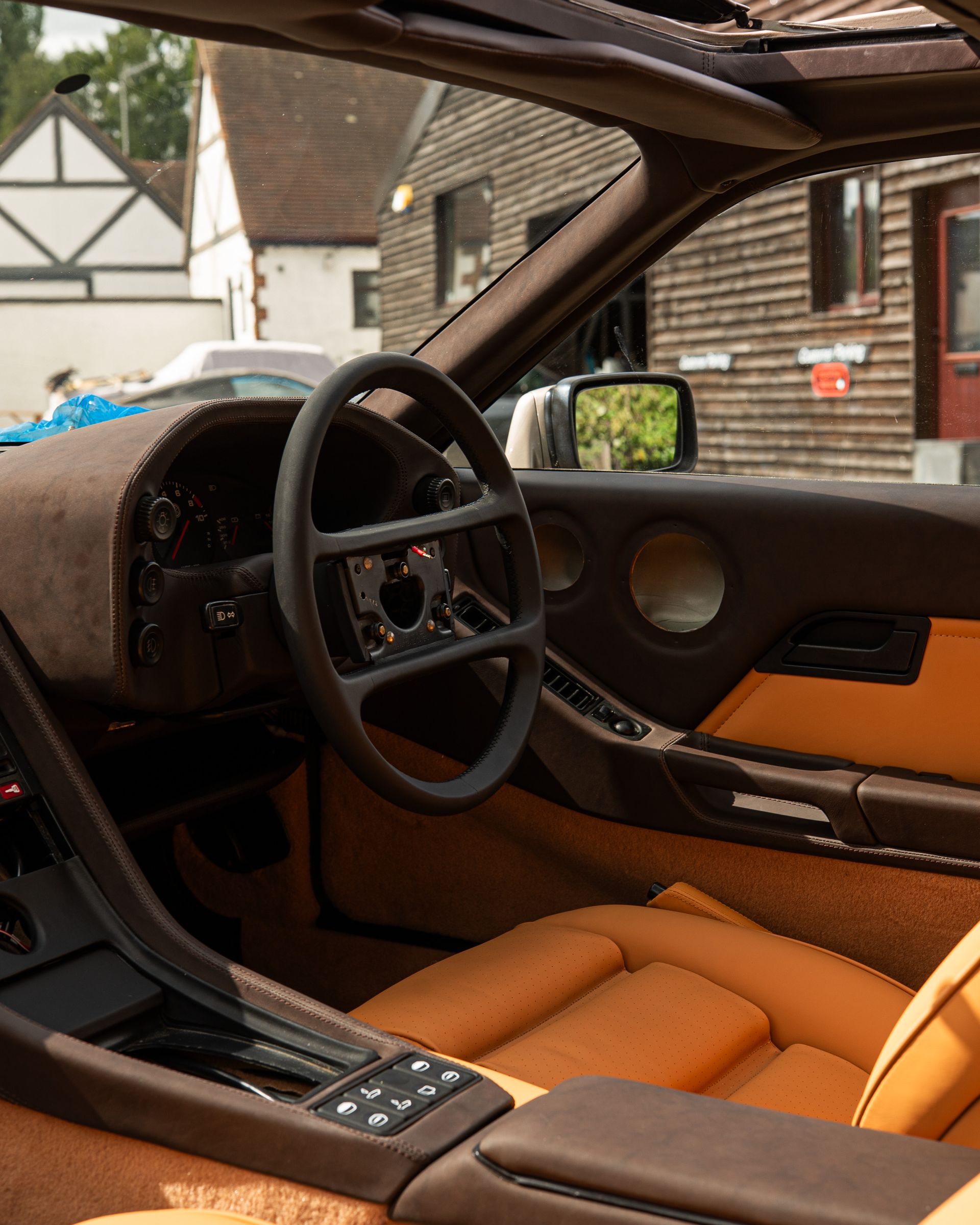 porsche 928 interior retrim leather brown tan cream restomod upholstery reupholstered singer dclass d:class restoration respray