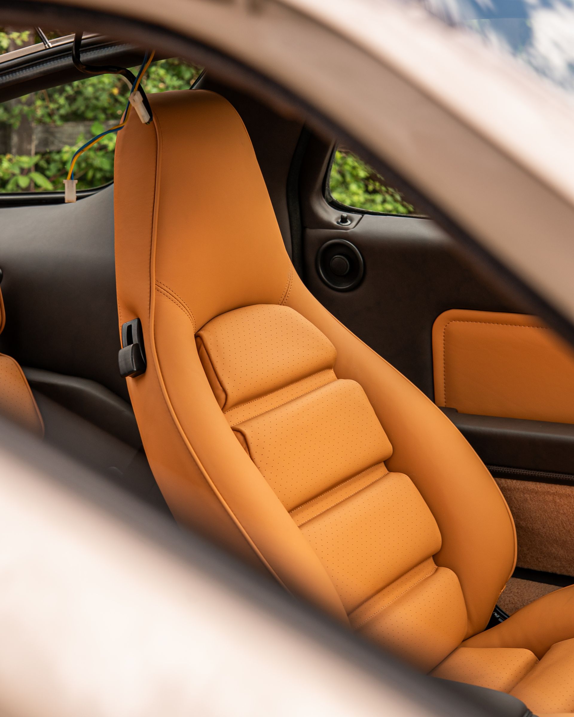 porsche 928 interior retrim leather brown tan cream restomod upholstery reupholstered singer dclass d:class restoration respray