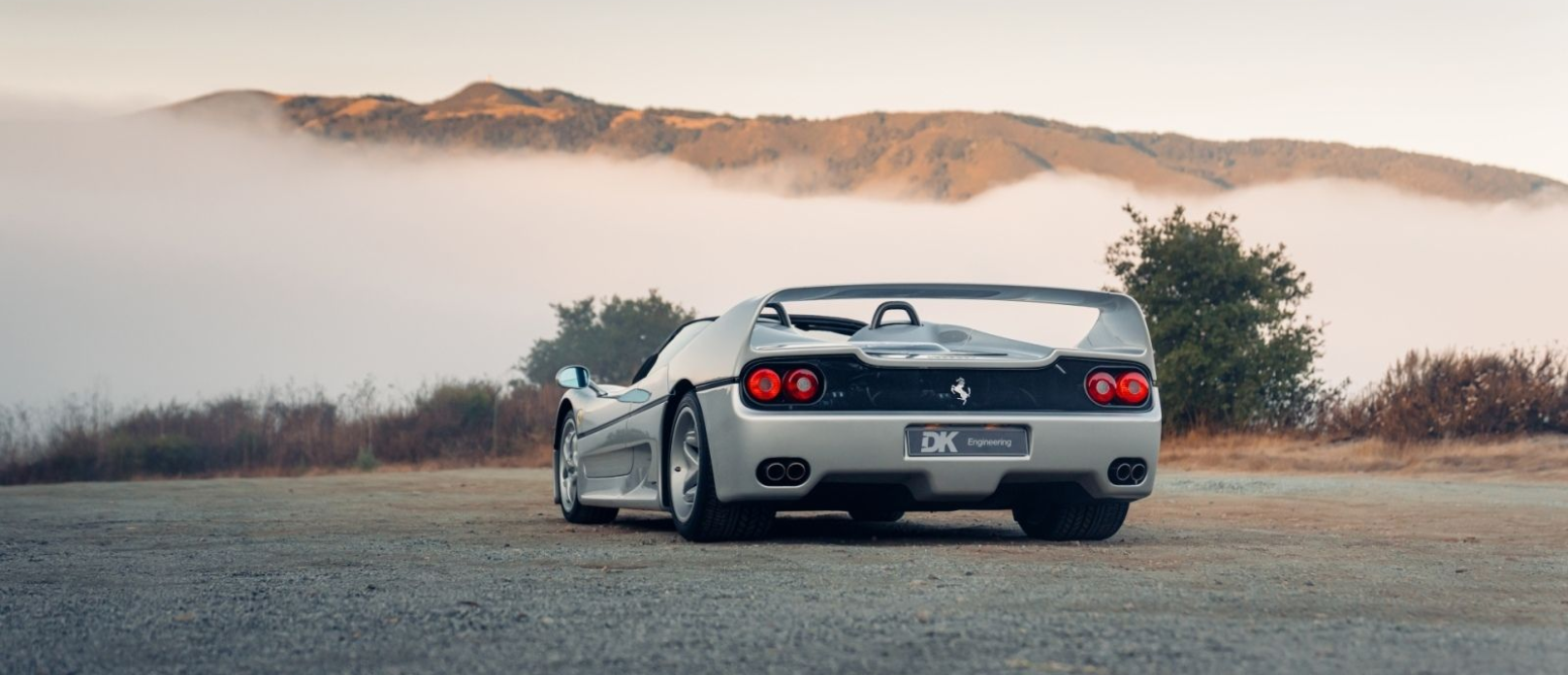 Silver Ferrari F50 DK Engineering convertible spyder monterey car week pebble beach for sale sold restoration