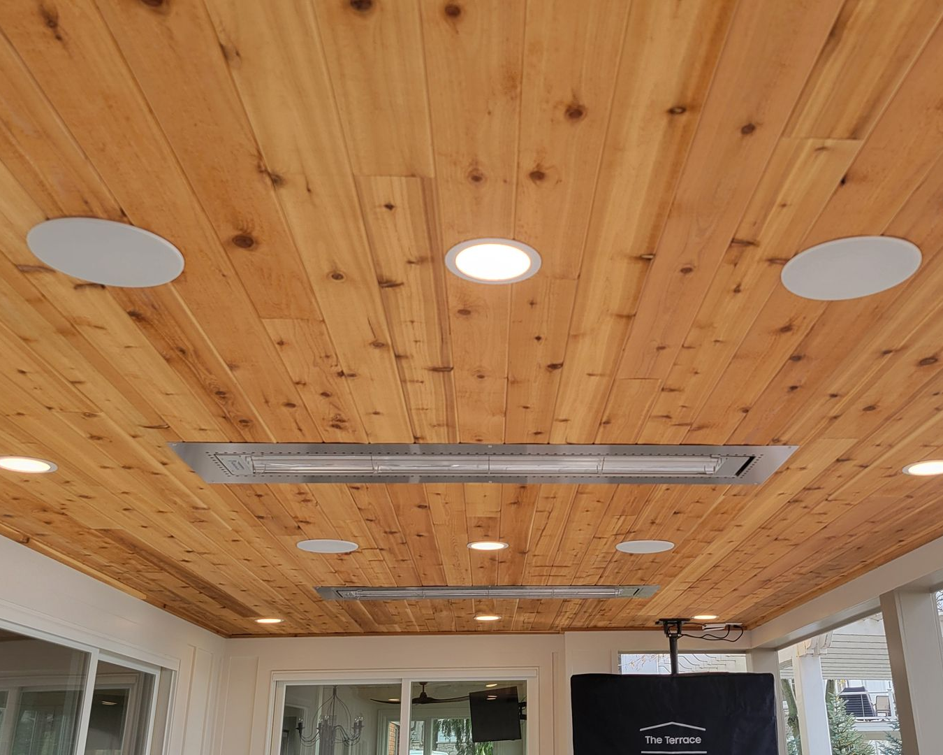 Outdoor covered patio with recessed speakers installed by Fisher Custom AV