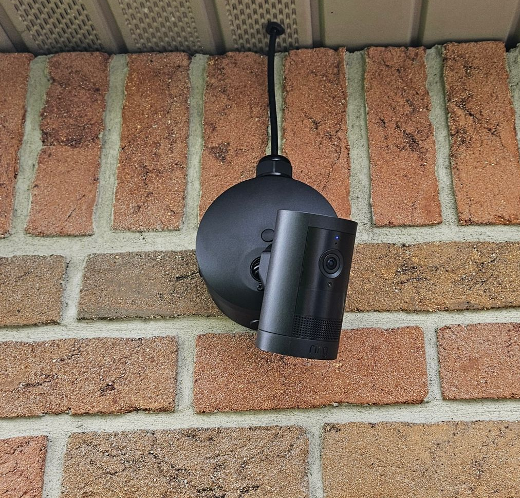 A security camera mounted on on a wall by fisher custom av in sandusky ohio