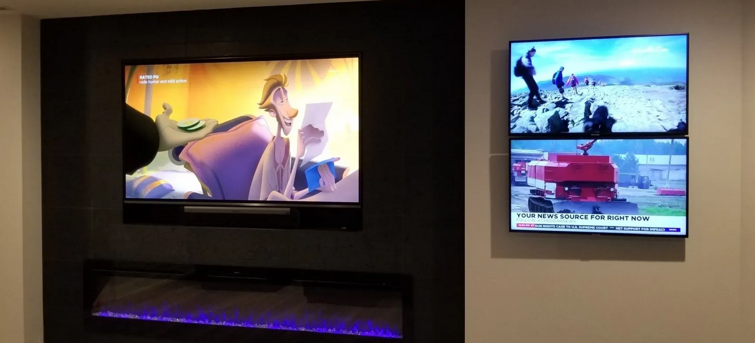 Custom audio video installation with three TVs in a home theater in a Norwalk, Ohio residence.