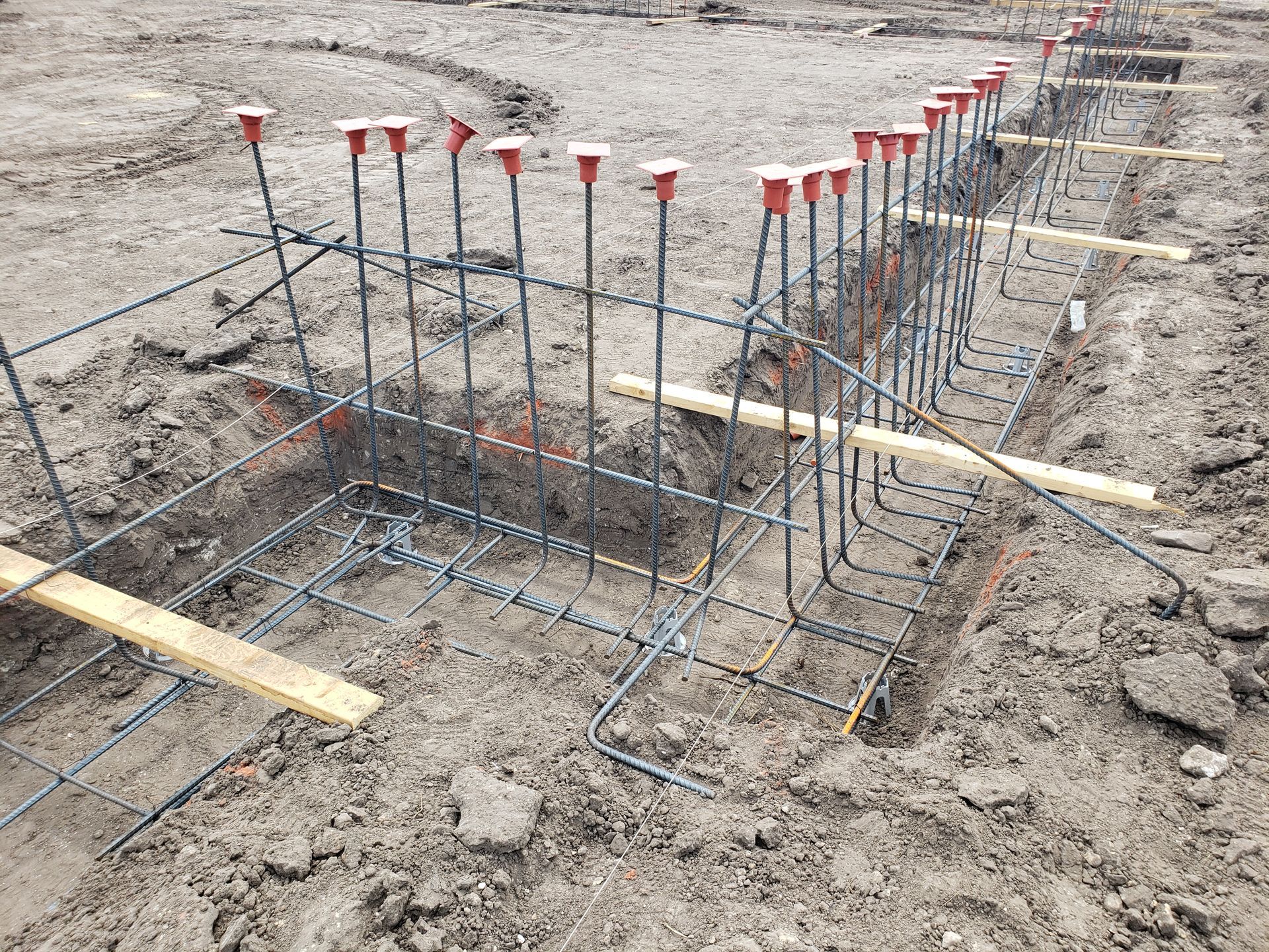 A concrete slab is being built on a construction site.