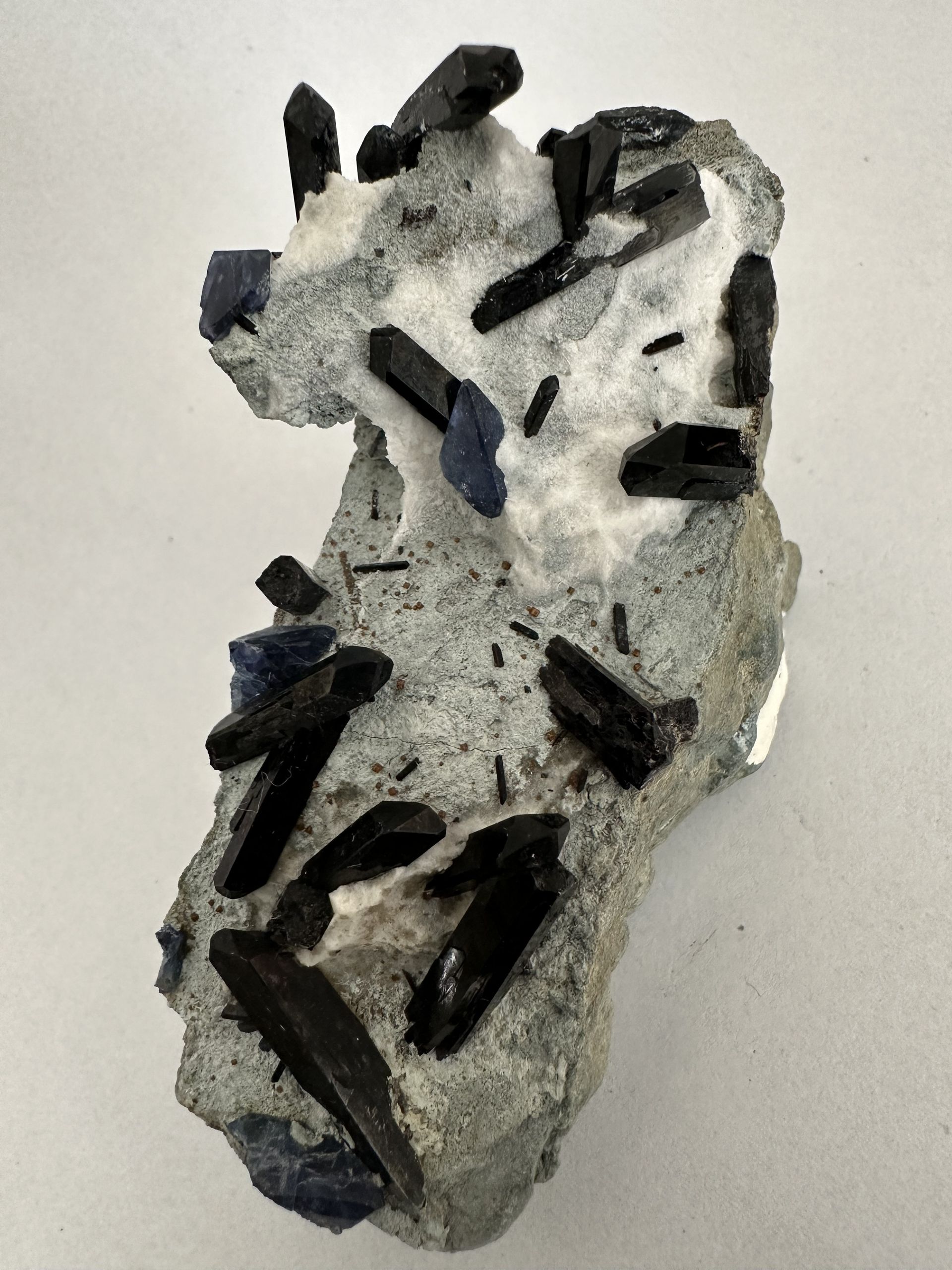 A close up of benitoite neptunite