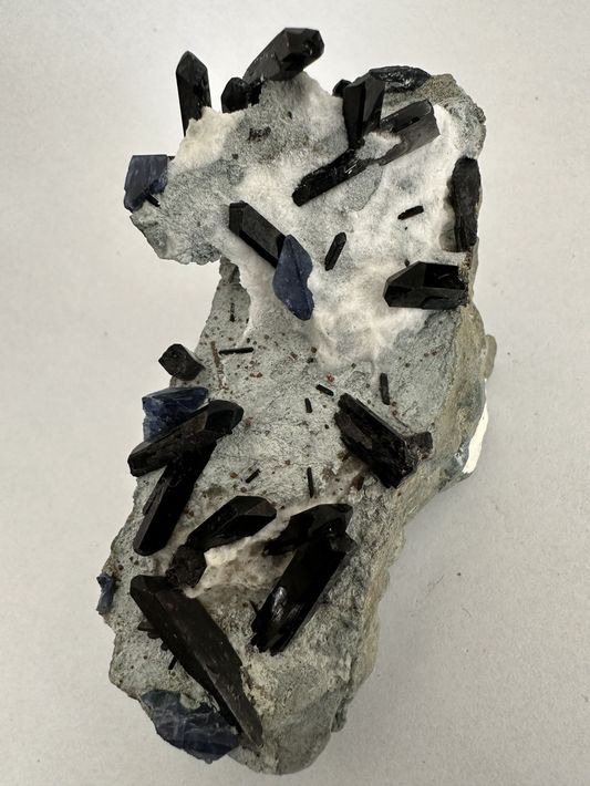 A close up of benitoite neptunite