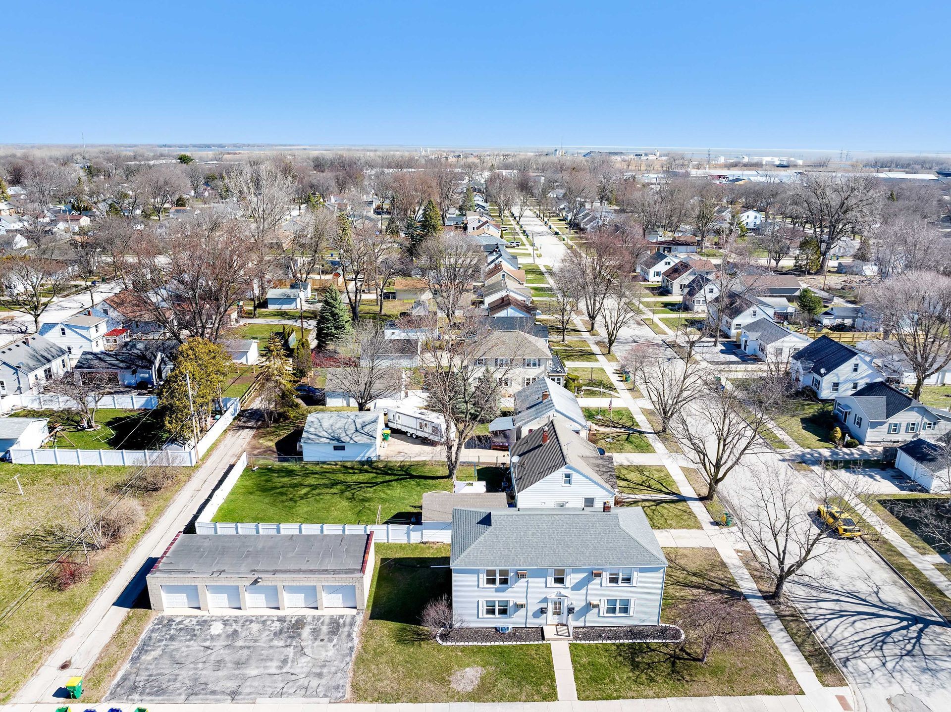 An aerial view of a residential area with lots of houses and trees.