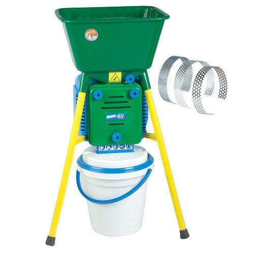 Photo of the small, green and yellow grinder for chicken food grain