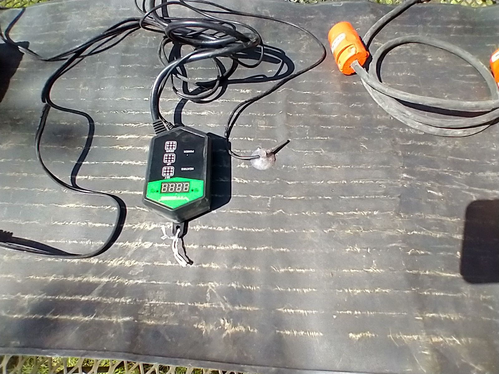 A heat mat for seedlings with motor and thermometer