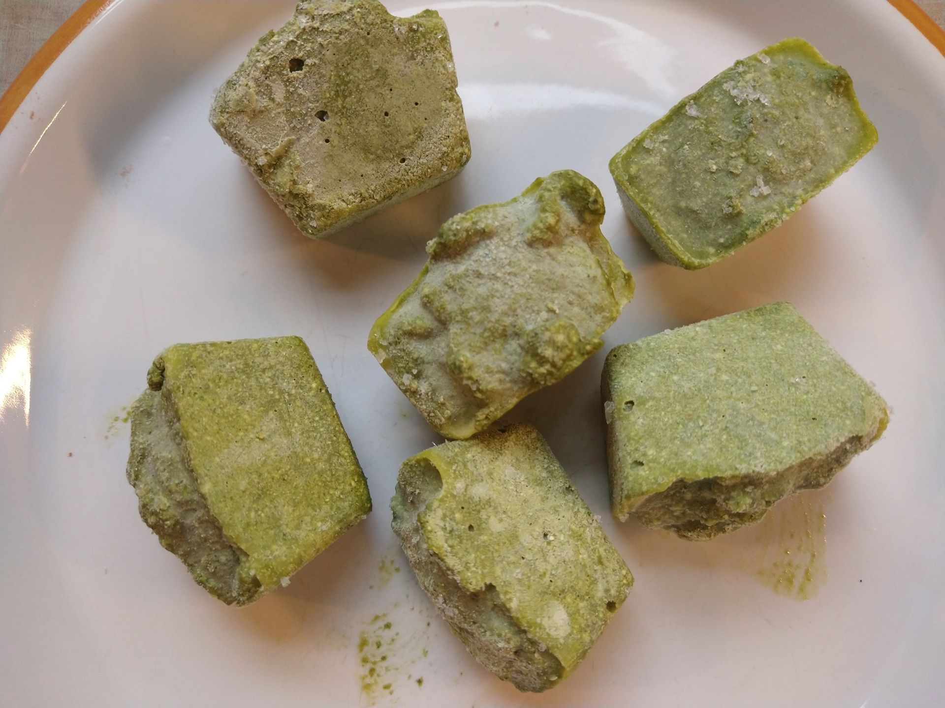 frozen pesto cubes on a plate