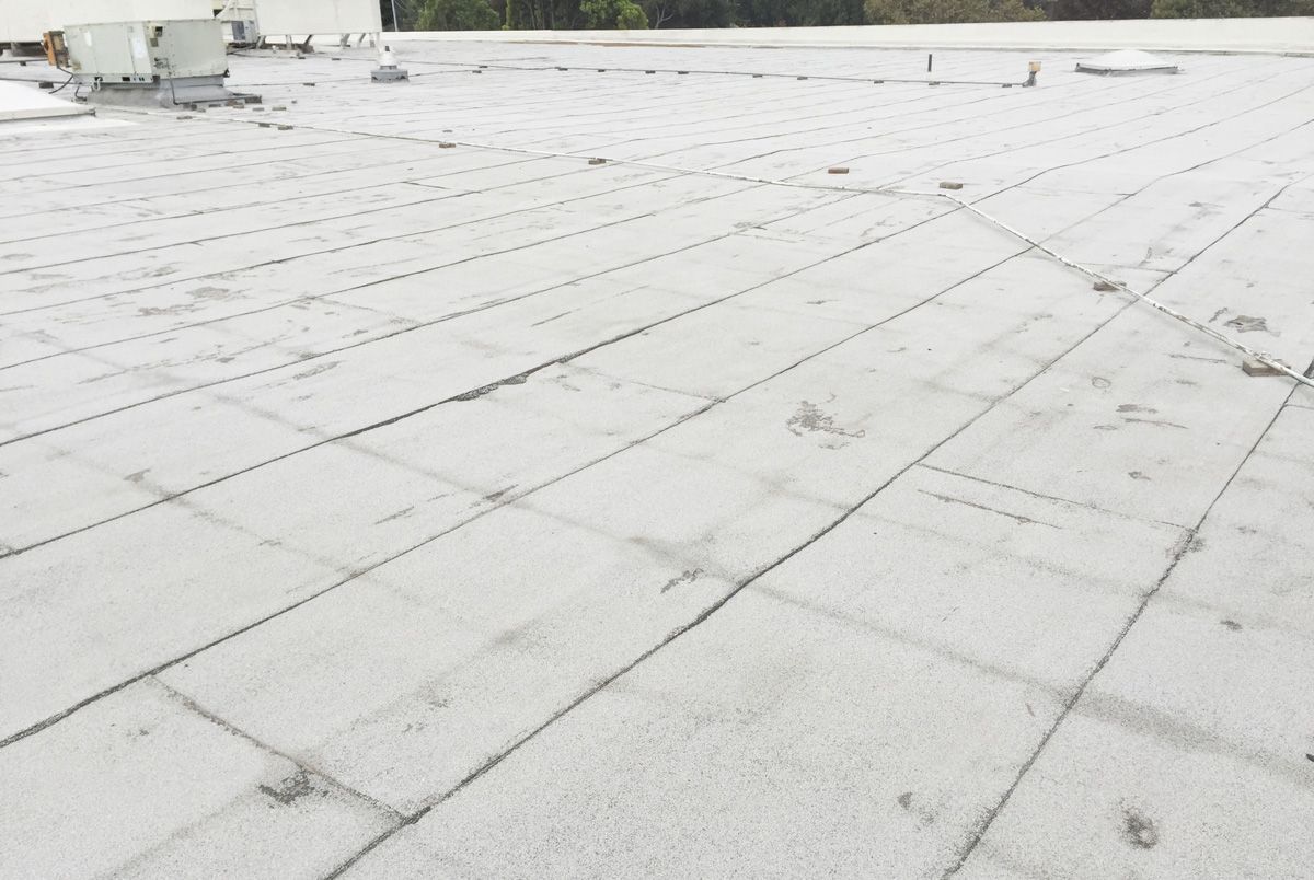 A white roof with a lot of lines on it.