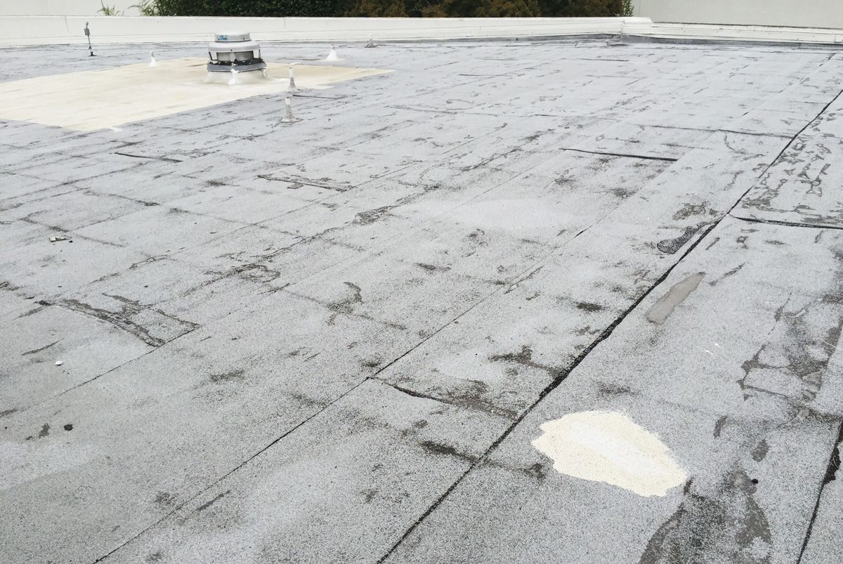 A close up of a roof with a hole in it.