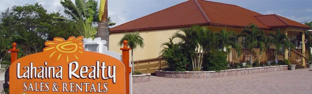 A logo for a real estate company called lahaina realty