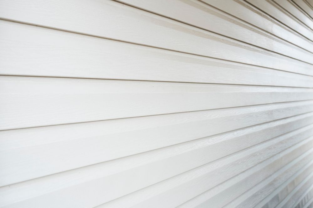 A close up of a white siding on a house.