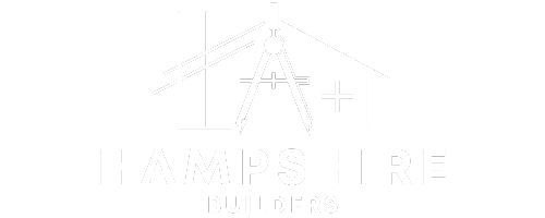 A white logo with a compass and a cross on a white background.