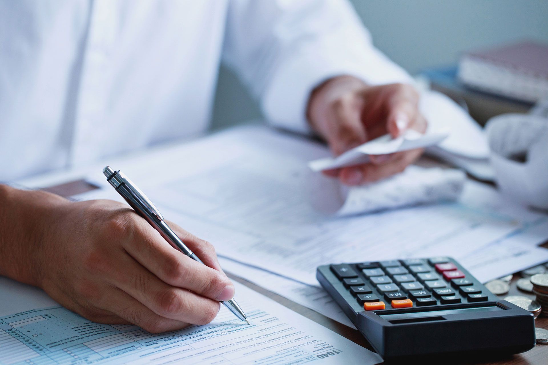 Local Professional Completing Business Tax Preparation Documents