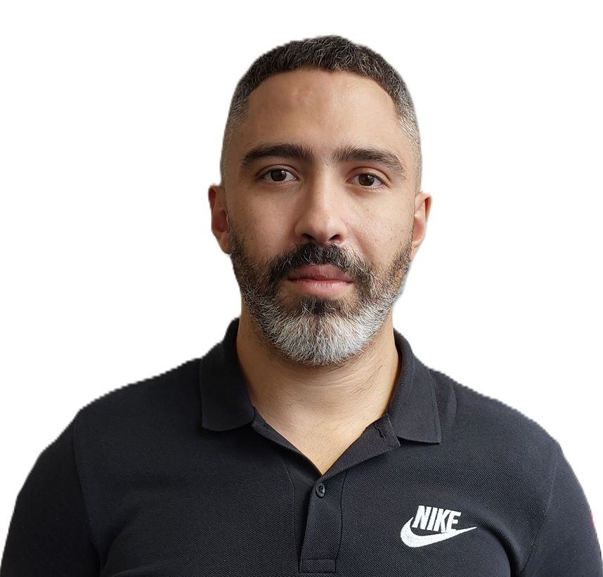 Manil, a professional Sports Therapist at R P Sports Injuries and Wellness Clinic, is wearing a black Nike polo shirt.
