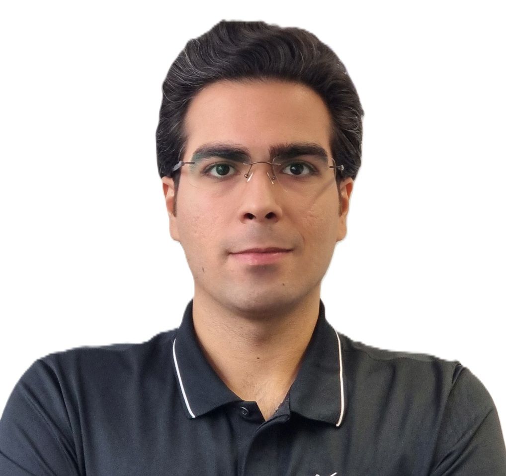 Mark, a Sports Therapist at R P Sports Injuries and wellness Clinic, is wearing glasses and a black collared shirt.