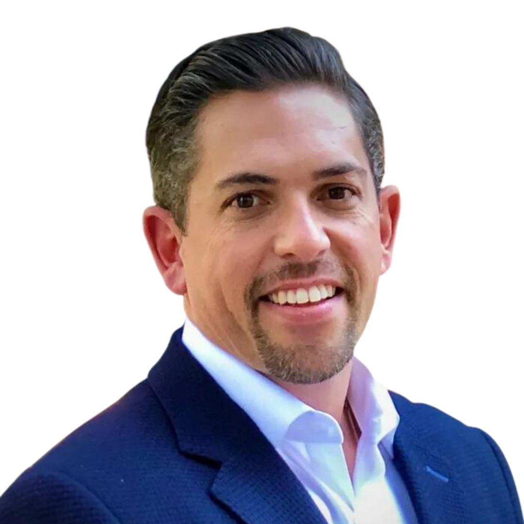 A man in a blue suit and white shirt is smiling