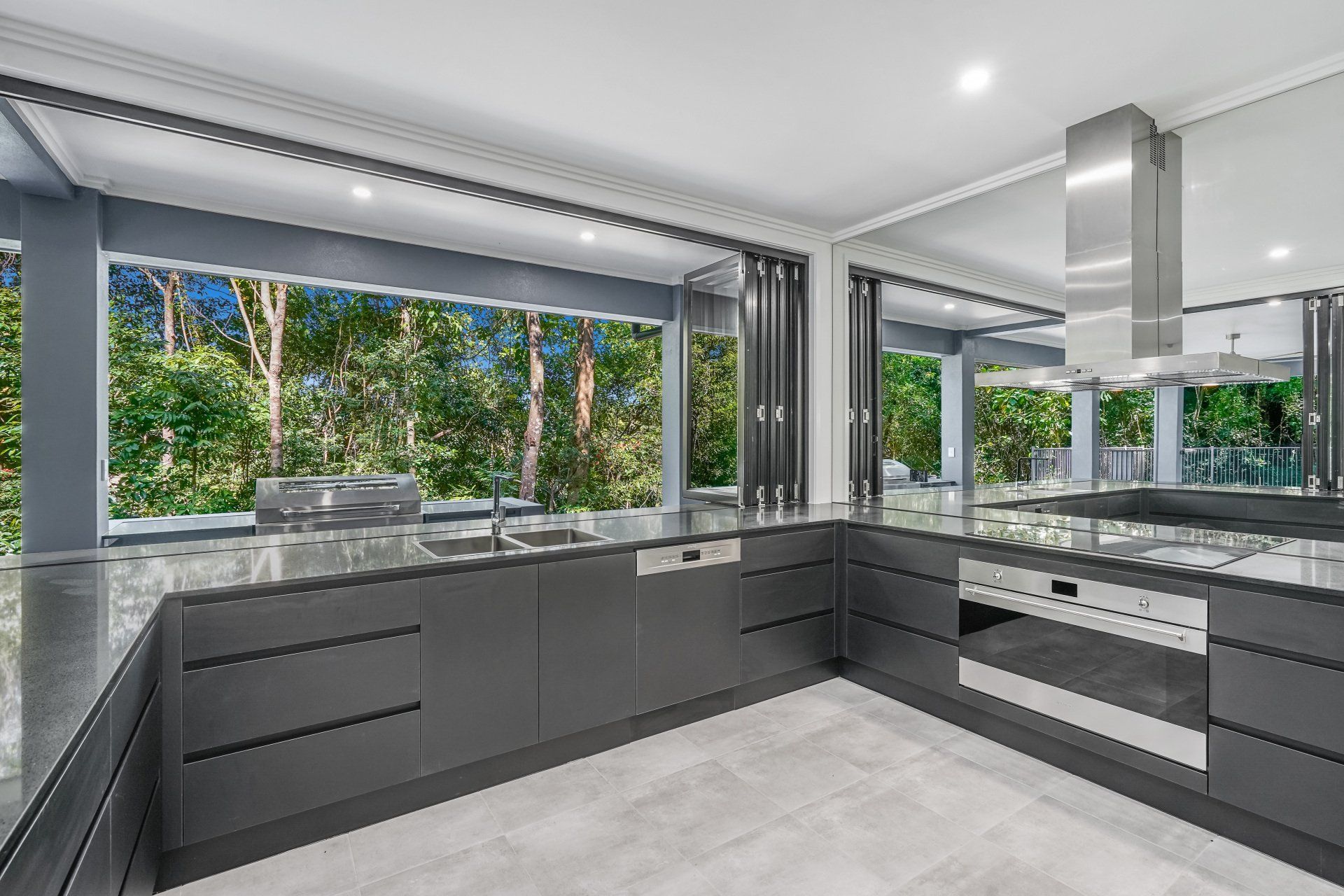Kitchen With Gray Cabinets And Countertop — Kitchen Design in Edmonton, QLD