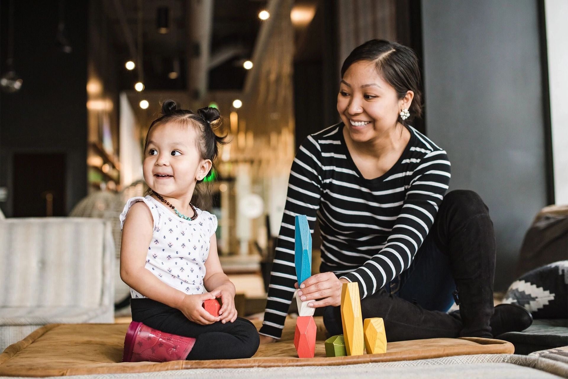 Mom Playing Building Blocks With Her Daughter
